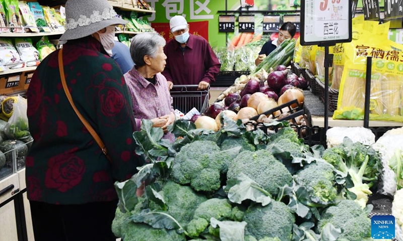 Customers buy vegetables at a supermarket in Shijiazhuang City, north China's Hebei Province, on May 11, 2026. (Photo by Li Mingfa/Xinhua)