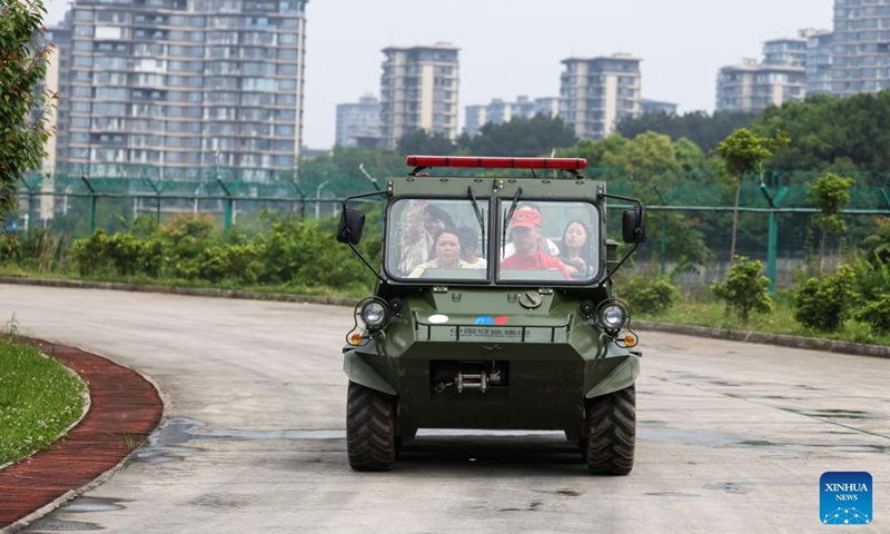 Citizens sit in an all-terrain vehicle during a public safety awareness event marking the National Disaster Prevention and Mitigation Day at a rescue base in Guiyang, southwest China's Guizhou Province, May 10, 2026. (Xinhua/Yang Wenbin)

