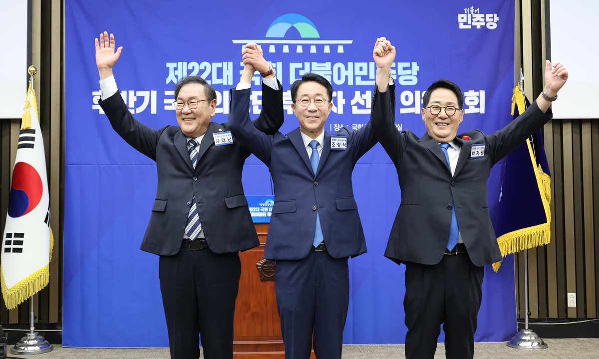 The ruling Democratic Party of Korea elects lawmaker Cho Jeong-sik (center) as its candidate for Speaker of the National Assembly in Seoul of South Korea, on May 13, 2026. Photo: IC