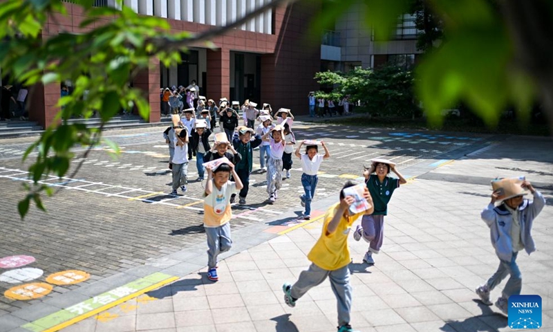 Students take part in an emergency evacuation drill in Kunshan City, east China's Jiangsu Province, May 12, 2026. A variety of activities were held across the country marking the National Disaster Prevention and Reduction Day on Tuesday. (Photo by Wang Xuzhong/Xinhua)
