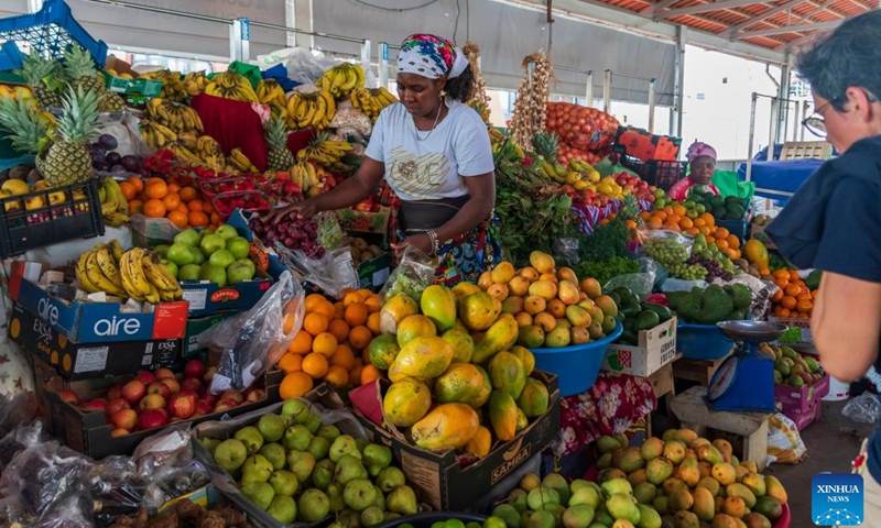 A vendor sells fruits at a market in Praia, Cape Verde, May 11, 2026. Located on the southern coast of Santiago Island in the Atlantic Ocean, Praia has colorful streets and vibrant musical culture. (Xinhua/Xie Jianfei)

