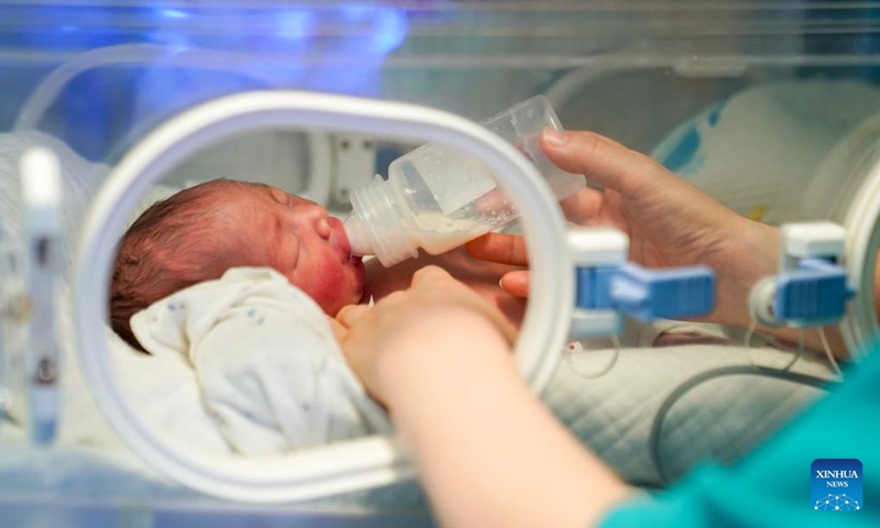 A nurse feeds a neonatal patient at the neonatology department of the First People's Hospital of Yunnan Province in Kunming, southwest China's Yunnan Province, May 10, 2026. As the neonatal nurses in the First People's Hospital of Yunnan Province, Yang Limei and her colleagues' routine work is to take care of the newborns suffering with critical illness like premature birth, asphyxia, congenital diseases or severe infections.

