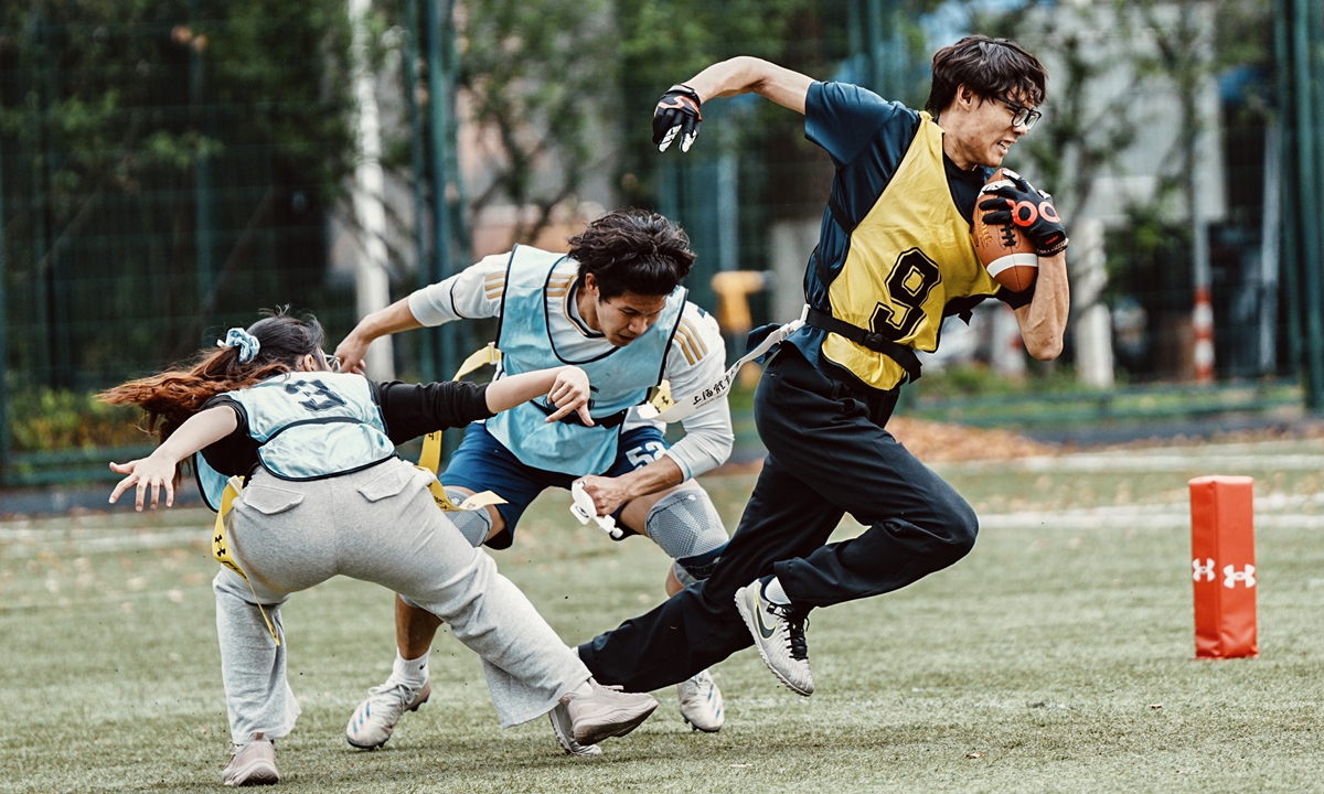 Students compete in a flag football 