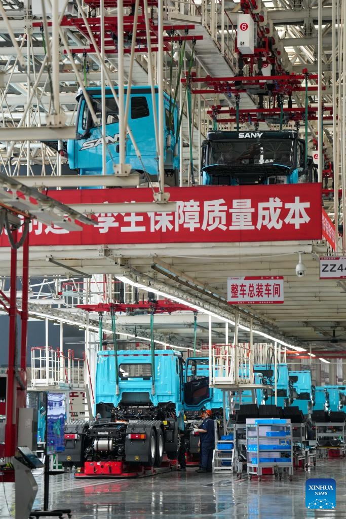 Workers work at an industrial park of Sany, China's leading heavy equipment manufacturer, in Changsha, central China's Hunan Province, May 12, 2026. Stepping into an intelligent heavy truck industrial park of Sany in Changsha, Hunan Province, one can see a bustling scene on the intelligent production lines.(Xinhua/Xue Yuge)