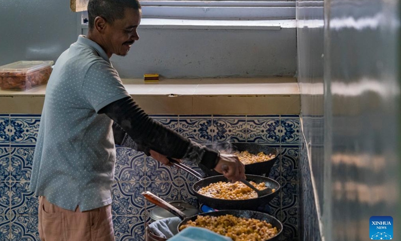 A cook makes Cachupa, a local specialty stew, at a restaurant on Sao Vicente Island, Cape Verde, May 13, 2026. Sao Vicente Island is located in the northwestern part of the Cape Verde archipelago. Characterized by volcanic mountains and arid hills, the island is best known for the port city of Mindelo and has become a popular tourist destination. (Xinhua/Xie Jianfei)


