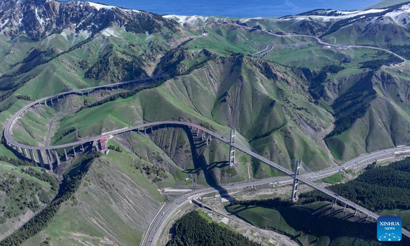 A drone photo taken on May 13, 2026 shows the Guozigou bridge on an expressway in Huocheng County, northwest China's Xinjiang Uygur Autonomous Region. (Xinhua/Hu Huhu)

