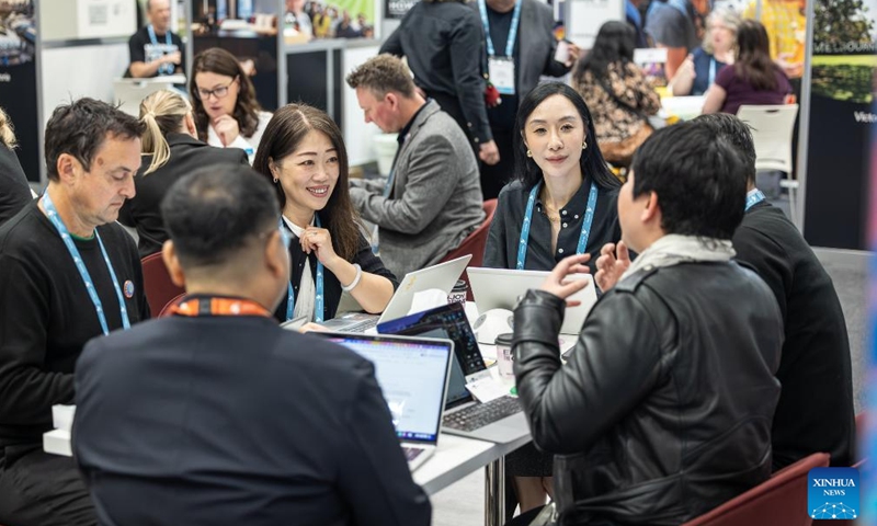 People communicate at the 46th Australian Tourism Exchange (ATE) in Adelaide, Australia, May 11, 2026. From May 10 to 14, the 46th ATE, hosted by Tourism Australia, brought together global buyers and Australian sellers in the tourism industry. (Tourism Australia/Handout via Xinhua)