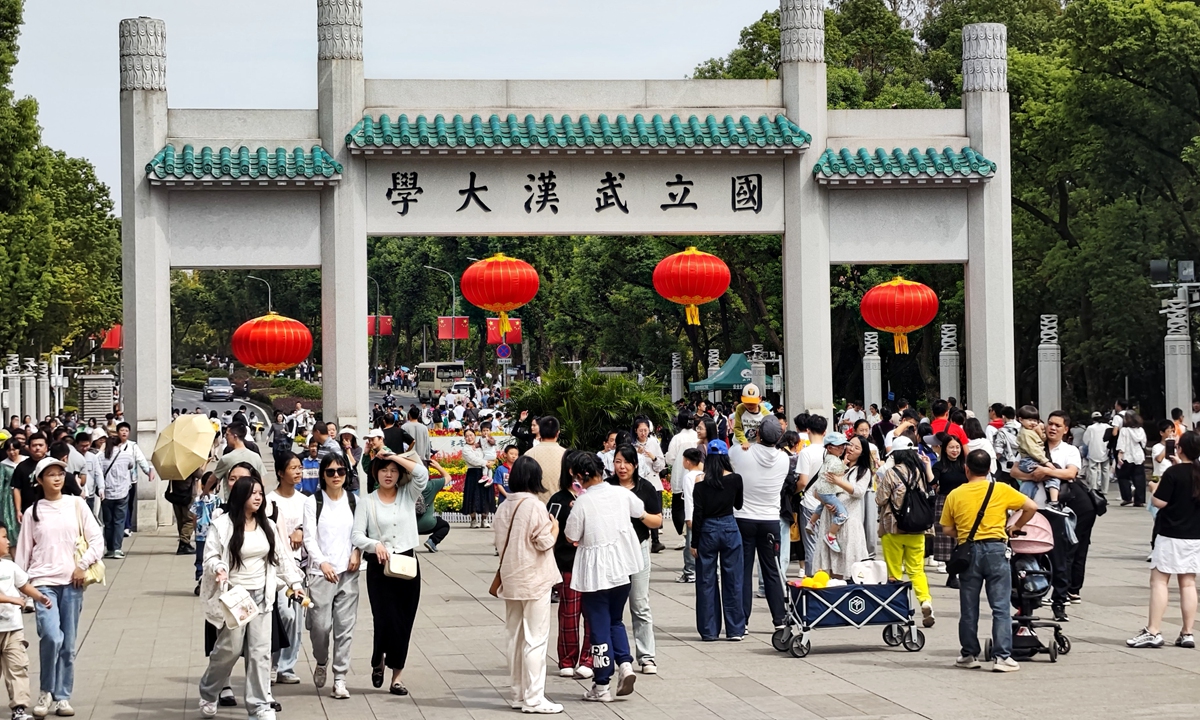 Visitors flock to Wuhan University in Central China's Hubei Province for sightseeing, study tours and photo check-ins. Photo: VCG