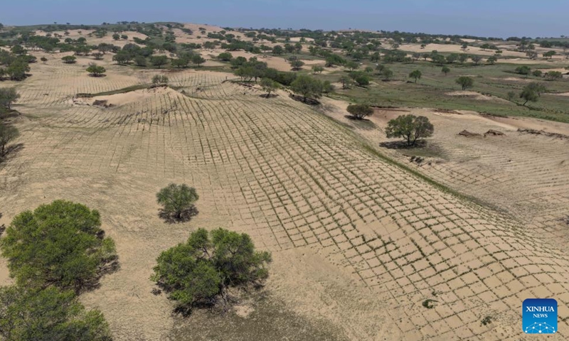 This aerial drone photo taken on May 13, 2026 shows the Hunshandake Sandland in Zhenglan Banner of Xilingol League, north China's Inner Mongolia Autonomous Region. Zhenglan Banner has applied mechanical sand control and other technical means in recent years to improve the efficiency of sandy land management. (Xinhua/Li Zhipeng)
