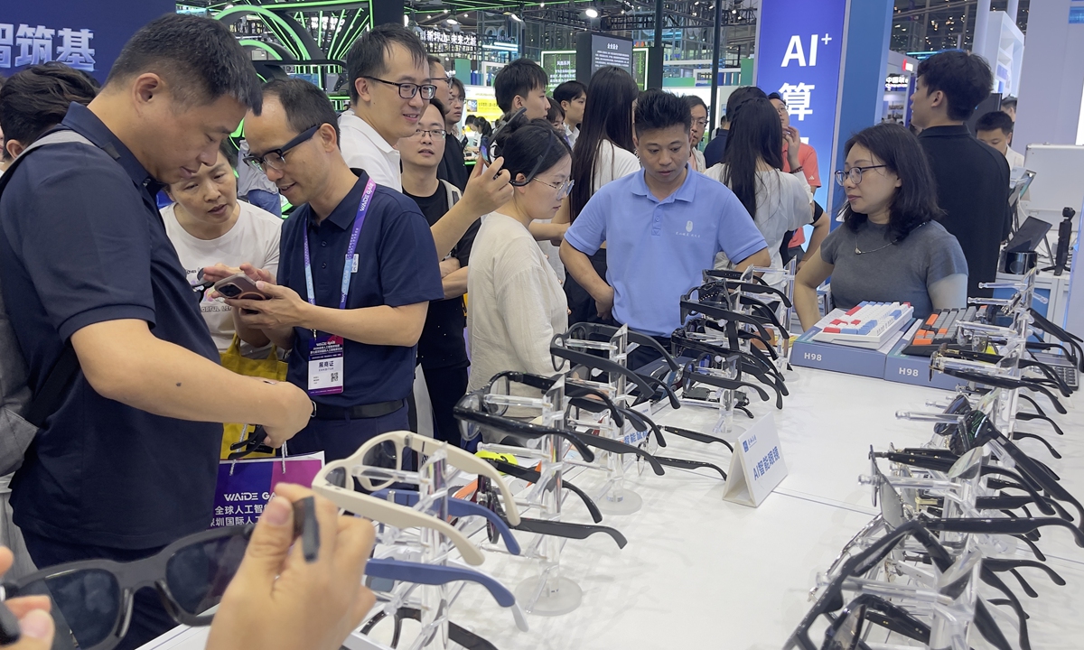 Visitors browse artificial intelligence (AI) glasses at the 7th Shenzhen Global AI Expo in Shenzhen, South China's Guangdong Province, on May 14, 2026. The exhibition attracted more than 500 companies from 15 countries and regions, showcasing cutting-edge terminal products such as AI smartphones, embodied AI robots and AI rings. Photo: VCG