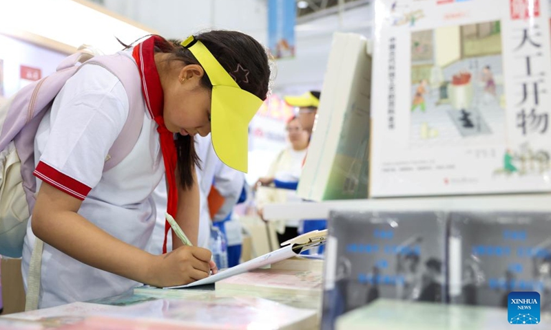 A child is seen during the third Northeast China Book Fair in Changchun, northeast China's Jilin Province, May 14, 2026. (Xinhua/Yan Linyun)

