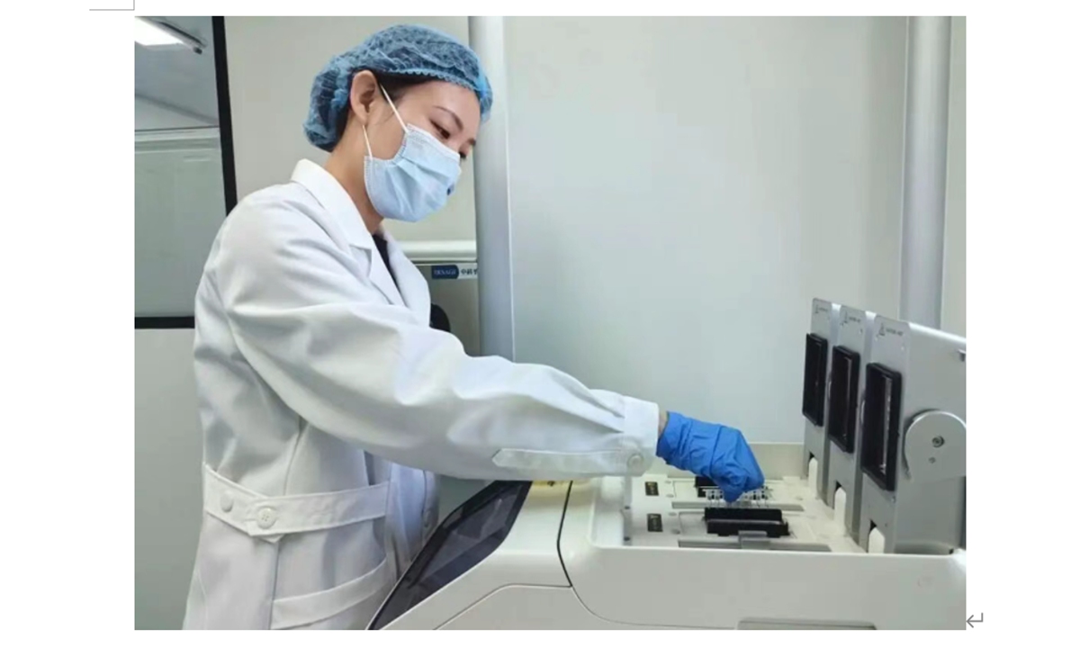 Zhang Mengting conducts DNA analysis work in a laboratory. Photo: Hubei Daily