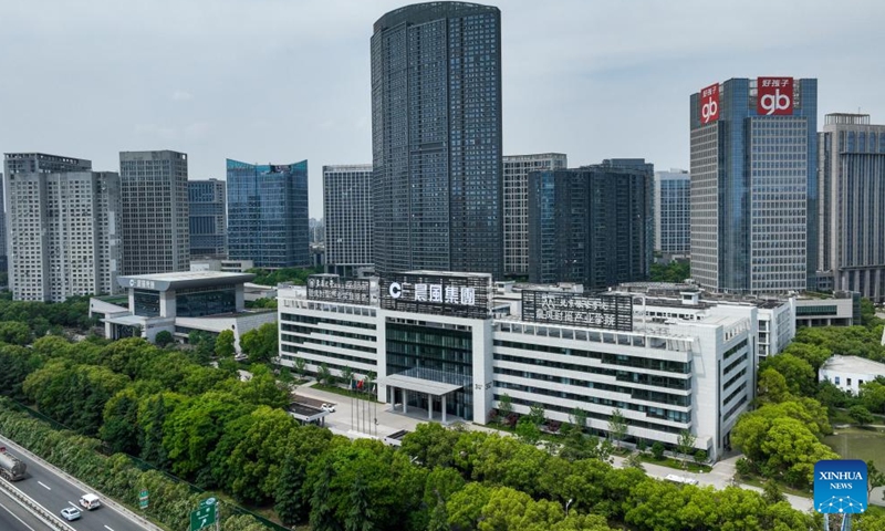 A drone photo shows a view of Chenfeng Fashion Creative Industrial Park in Kunshan City, east China's Jiangsu Province, May 13, 2026. Backed by leading textile and garment enterprises in the country, Kunshan has launched the Chenfeng Fashion Creative Industrial Park, which is now home to nearly 150 businesses in the fashion arena. Over 30 emerging brands have been incubated there. (Xinhua/Li Bo)

