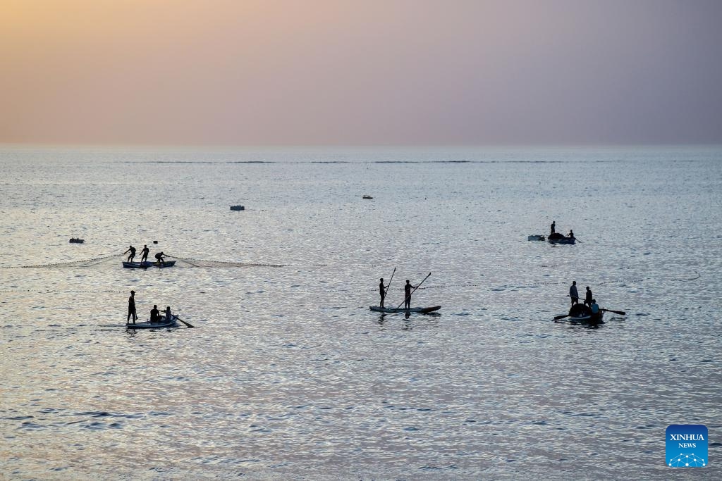 This photo taken on May 14, 2026 shows Palestinian fishermen seen near the seashore west of the Gaza City. (Photo: Xinhua)