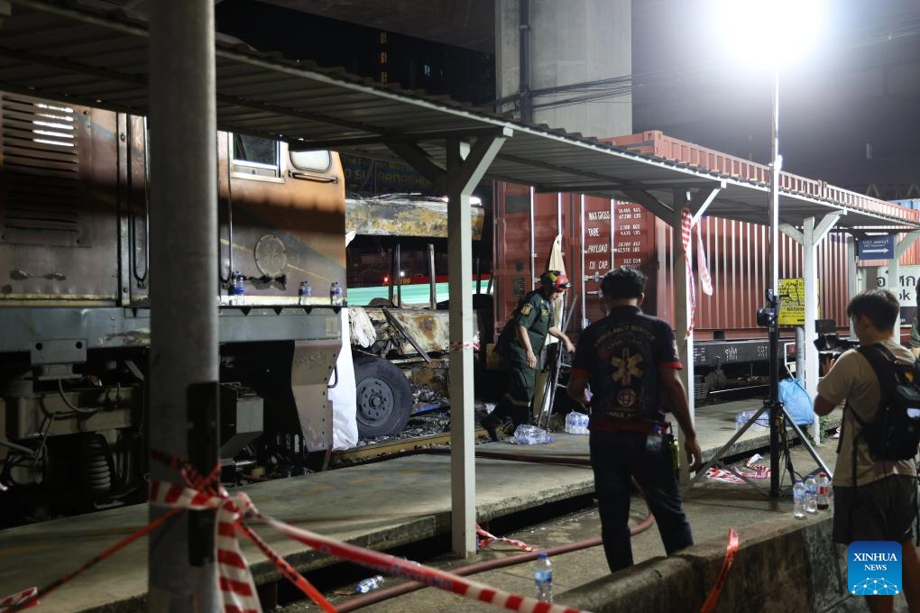 This photo taken on May 16, 2026 shows a scene at the site of a train-bus collision in Bangkok, Thailand. A train and a bus collided in Bangkok, Thailand, on Saturday afternoon, killing eight people, local media reported. At around 3:40 p.m., a train collided with a bus at a railway crossing in Ratchathewi District, triggering a fire accompanied by an explosion. Several other cars and motorcycles were also involved. More than 20 people were injured, according to local media, as rescuers rushed to the scene to put out the fire and carry out rescue operations. (Photo: Xinhua)