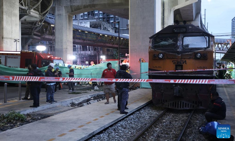 Cordons are seen near the site of a train-bus collision in Bangkok, Thailand, May 16, 2026. A train and a bus collided in Bangkok, Thailand, on Saturday afternoon, killing eight people, local media reported. At around 3:40 p.m., a train collided with a bus at a railway crossing in Ratchathewi District, triggering a fire accompanied by an explosion. Several other cars and motorcycles were also involved. More than 20 people were injured, according to local media, as rescuers rushed to the scene to put out the fire and carry out rescue operations. (Photo: Xinhua)