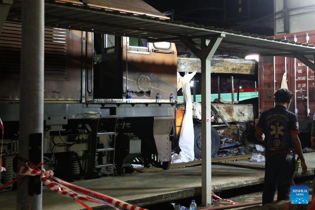 This photo taken on May 16, 2026 shows a scene at the site of a train-bus collision in Bangkok, Thailand. A train and a bus collided in Bangkok, Thailand, on Saturday afternoon, killing eight people, local media reported. At around 3:40 p.m., a train collided with a bus at a railway crossing in Ratchathewi District, triggering a fire accompanied by an explosion. Several other cars and motorcycles were also involved. More than 20 people were injured, according to local media, as rescuers rushed to the scene to put out the fire and carry out rescue operations. (Photo: Xinhua)