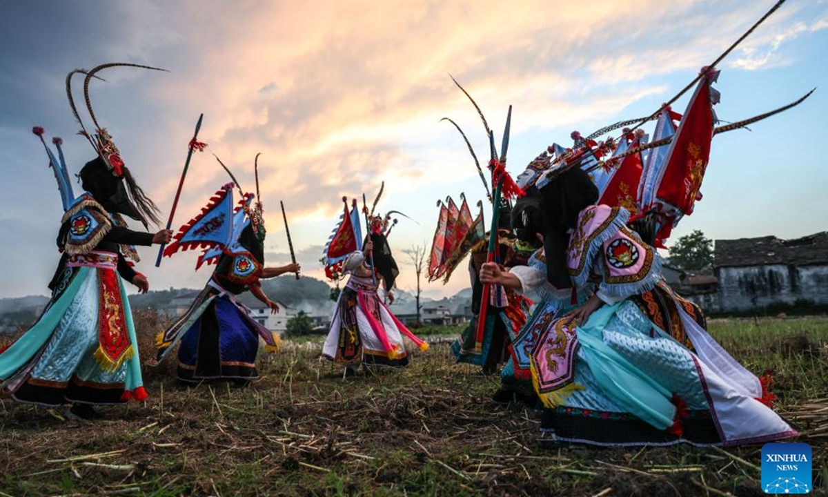 Villagers rehearse Dixi opera in a cole field in Wujiatun of Zhangzhuang Village, Qiyanqiao Town of Anshun City, southwest China's Guizhou Province, May 13, 2026. (Xinhua/Yang Wenbin)

