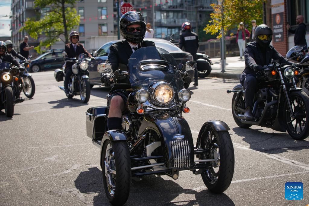 Riders in vintage attire take part in the 2026 Distinguished Gentleman's Ride in Vancouver, British Columbia, Canada, on May 17, 2026. The annual event was held in many cities across Canada on Sunday to raise funds and awareness for men's health, attracting more than 300 dapper riders. (Photo by Liang Sen/Xinhua)