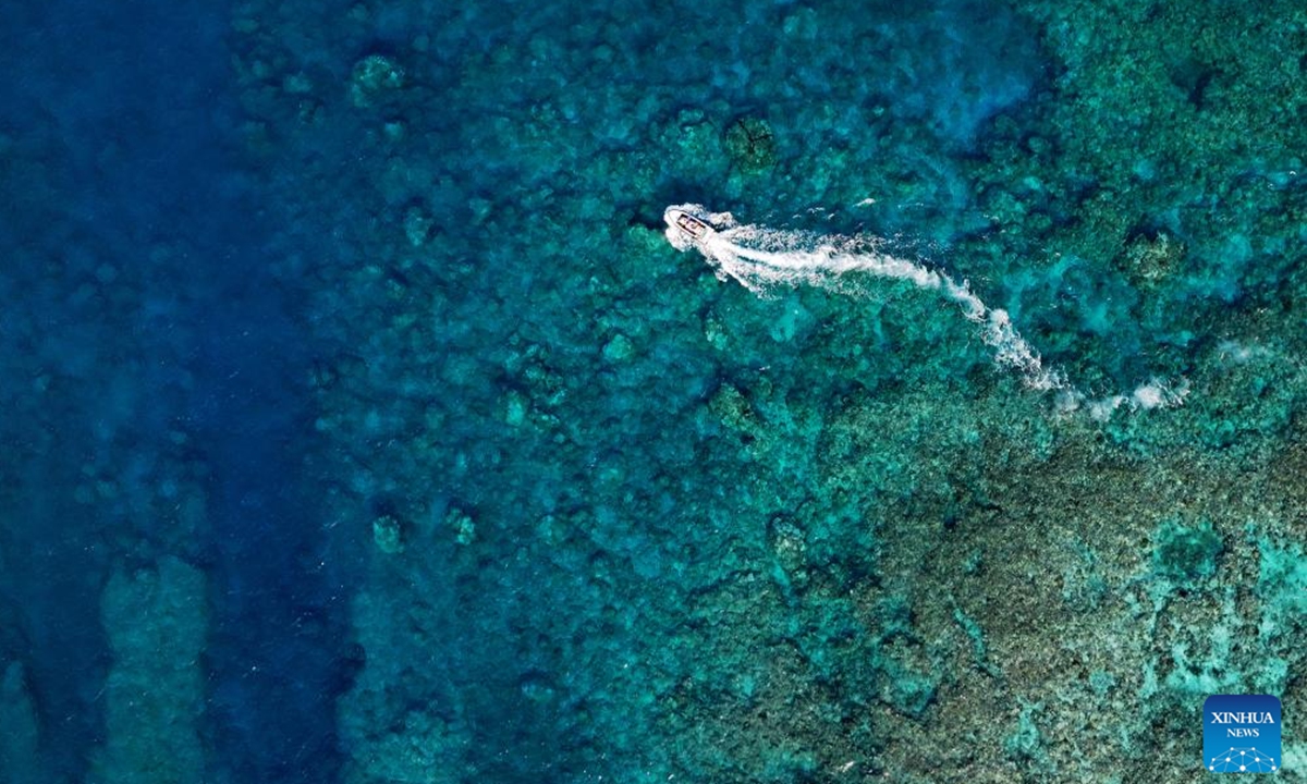 An aerial drone photo shows a boat deployed by the China Coast Guard (CCG) vessel Chuanshan patrolling near a reef in the territorial waters of China's Huangyan Dao in the South China Sea, April 24, 2026.(Xinhua/Chen Bin)
