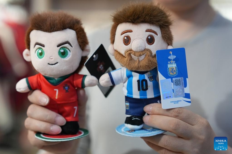 A vendor displays World Cup-themed merchandise at the Yiwu International Trade Market in Yiwu, east China's Zhejiang Province, May 15, 2026. As the 2026 FIFA World Cup draws near, World Cup-themed merchandise produced in Yiwu is in high demand. Yiwu is famous for small commodities manufacturing. According to local sources, most manufacturers began taking and producing orders related to the 2026 World Cup as early as last year, with products being shipped to markets around the world. (Xinhua/Huang Zongzhi)