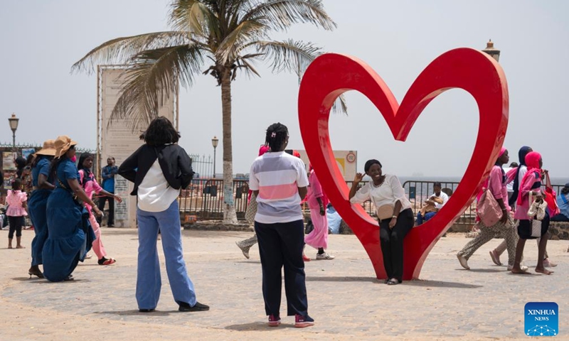 Tourists visit Goree Island in Senegal on May 16, 2026. Goree Island lies off the coast of Senegal, opposite Dakar. Ruled in succession by the Portuguese, Dutch, English and French, it was the largest slave-trading center on the African coast from the 15th to the 19th century. (Xinhua/Xie Jianfei)