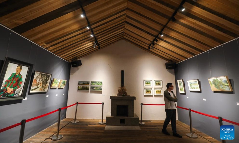 This photo taken on May 16, 2026 shows an art exhibition hall converted from abandoned prefabricated houses in Zhijiang Village of Xiaya Town, Jiande City of east China's Zhejiang Province. A photography + oil painting dual art exhibition was unveiled in Zhijiang Village of Xiaya Town on Saturday. Breaking the conventional boundaries of traditional art galleries, the exhibition is set amid fields, forests, and village paths. A total of 90 photography and oil painting works showcased the local rural customs and landscapes, with the majority of the artists being local villagers. Photo: Xinhua