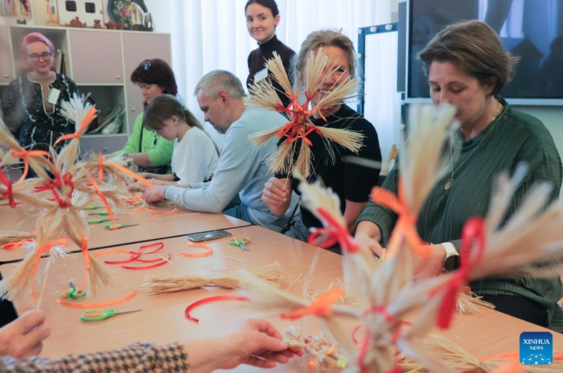Visitors learn to make ethnic handicrafts at the Russian Museum of Ethnography in St. Petersburg, Russia, May 16, 2026. During the Night of Museums, an event held from May 16 to 17 in Russia, more than 140 museums, galleries, libraries, exhibition halls and concert halls stay open from evening till night, to mark the upcoming International Museum Day, observed globally on May 18. (Photo by Irina Motina/Xinhua)