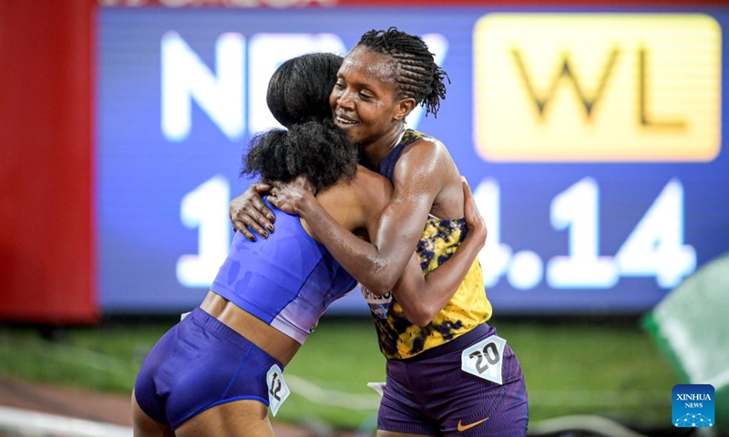 Faith Kipyegon (R) of Kenya hugs Likina Amebaw of Ethiopia after the women's 5000m final at the Yangtze River Delta Athletics Diamond Gala in Shaoxing, east China's Zhejiang Province, May 16, 2026. (Xinhua/Jiang Han)