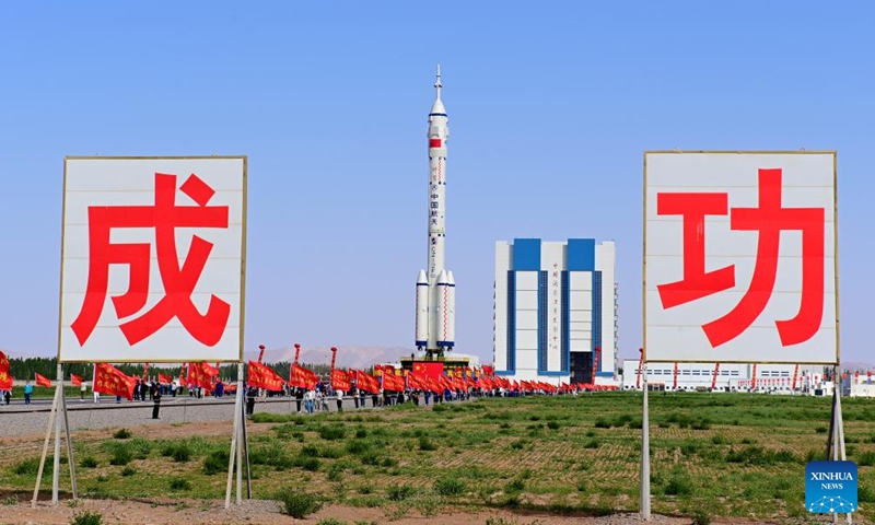 This photo taken on May 16, 2026 shows the combination of the Shenzhou-23 crewed spaceship and a Long March-2F carrier rocket being transferred to the launching area. (Photo by Wang Jiangbo/Xinhua)