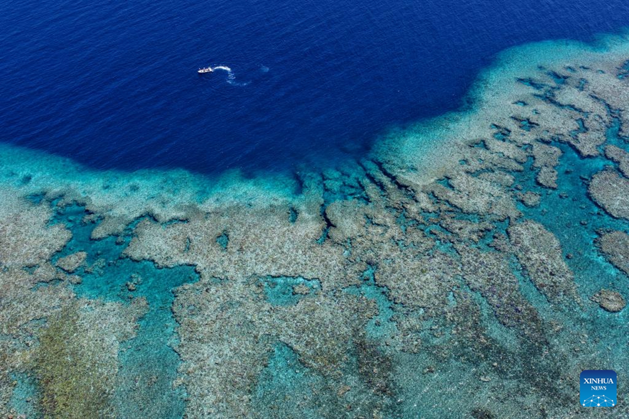 An aerial drone photo shows a boat deployed by the China Coast Guard (CCG) vessel Chuanshan patrolling near a reef in the territorial waters of China's Huangyan Dao in the South China Sea, April 28, 2026.(Xinhua/Chen Bin)
