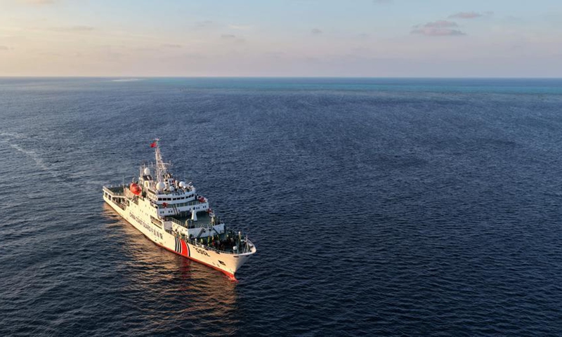 An aerial drone photo taken on May 1, 2026 shows the China Coast Guard (CCG) vessel Chuanshan patrolling around reefs in the territorial waters of China's Huangyan Dao in the South China Sea. (Xinhua/Chen Bin)