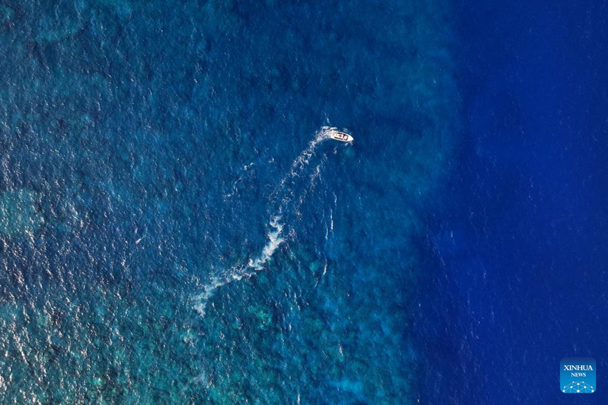 An aerial drone photo shows a boat deployed by the China Coast Guard (CCG) vessel Chuanshan patrolling near a reef in the territorial waters of China's Huangyan Dao in the South China Sea, April 28, 2026.(Xinhua/Chen Bin)

