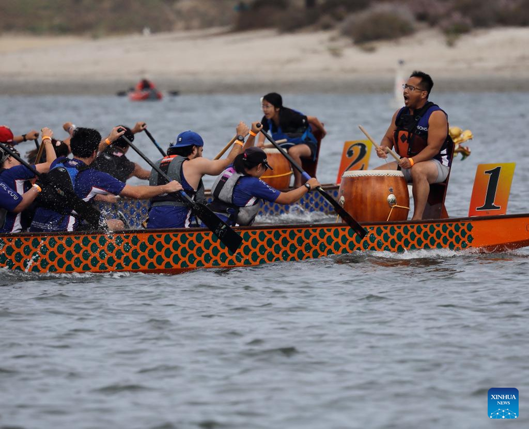 Contestants compete during the annual San Diego Dragon Boat Festival at Mission Bay in San Diego, California, the United States, on May 16, 2026. (Photo by Qiu Chen/Xinhua)

