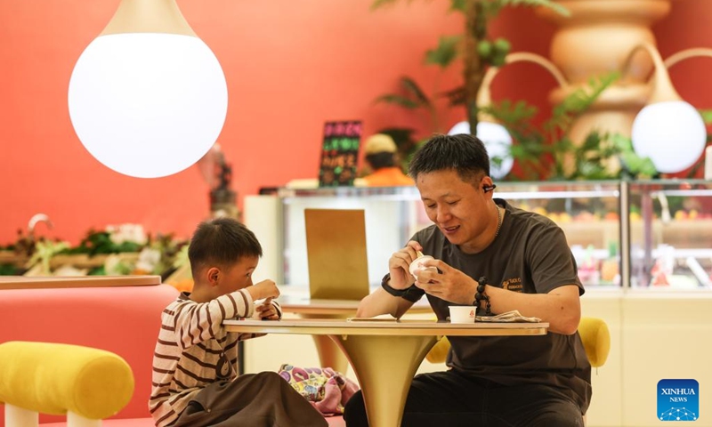 People taste ice cream at an ice cream museum in Shenyang, northeast China's Liaoning Province, May 16, 2026. There are several food-themed museums in Shenyang, Liaoning Province, among which the ice cream museum is a notable example.

Located in Dadong District of Shenyang, the museum covers an area of approximately 6,000 square meters that accommodates 11 major themed zones.

In addition to displaying vintage, time-honored ice cream making machines, it also offers visitors hands-on ice cream making experiences. Blending both recreational fun and educational value, it has become a well-loved destination for tourists. Photo: Xinhua