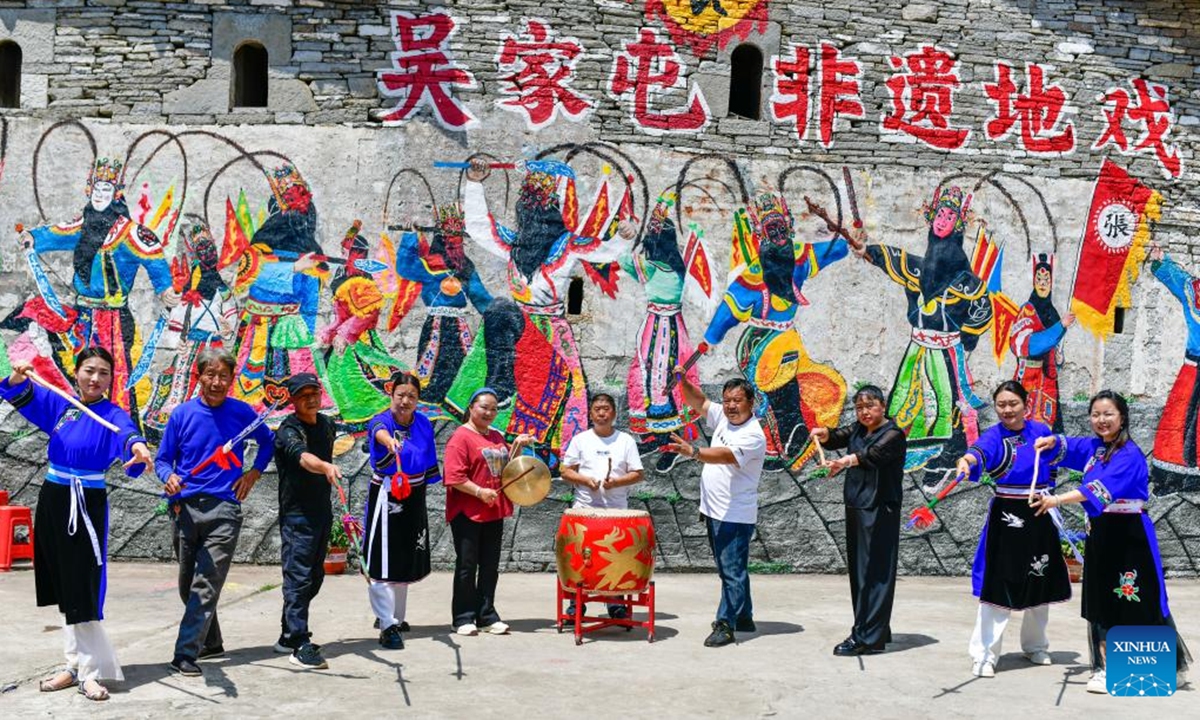 Villagers performing Dixi opera pose for a group photo in Wujiatun of Zhangzhuang Village, Qiyanqiao Town of Anshun City, southwest China's Guizhou Province, May 13, 2026. (Xinhua/Yang Wenbin)

