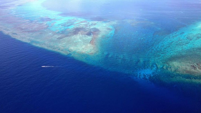 An aerial drone photo taken on May 12, 2026 shows a boat deployed by the China Coast Guard (CCG) vessel Chuanshan patrolling in the territorial waters of China's Huangyan Dao in the South China Sea. (Xinhua/Chen Bin)