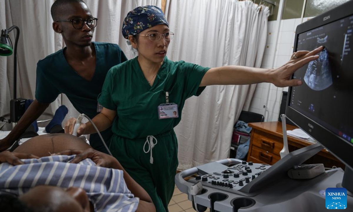 Luo Jinying (R), chief obstetrician with the 17th batch of the Chinese medical team to Botswana, conducts Doppler ultrasound examination for a local pregnant woman at Princess Marina Hospital in Gaborone, Botswana, May 5, 2026. (Xinhua/Yang Guang)

