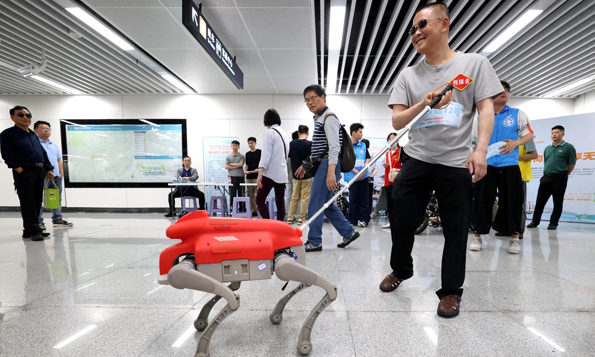 A visually impaired passenger experiences the electronic guide dog service at a subway station in Fuzhou, East China's Fujian Province on May 17, 2026, as China's 36th National Day for Assisting Persons with Disabilities approaches. Photo: VCG