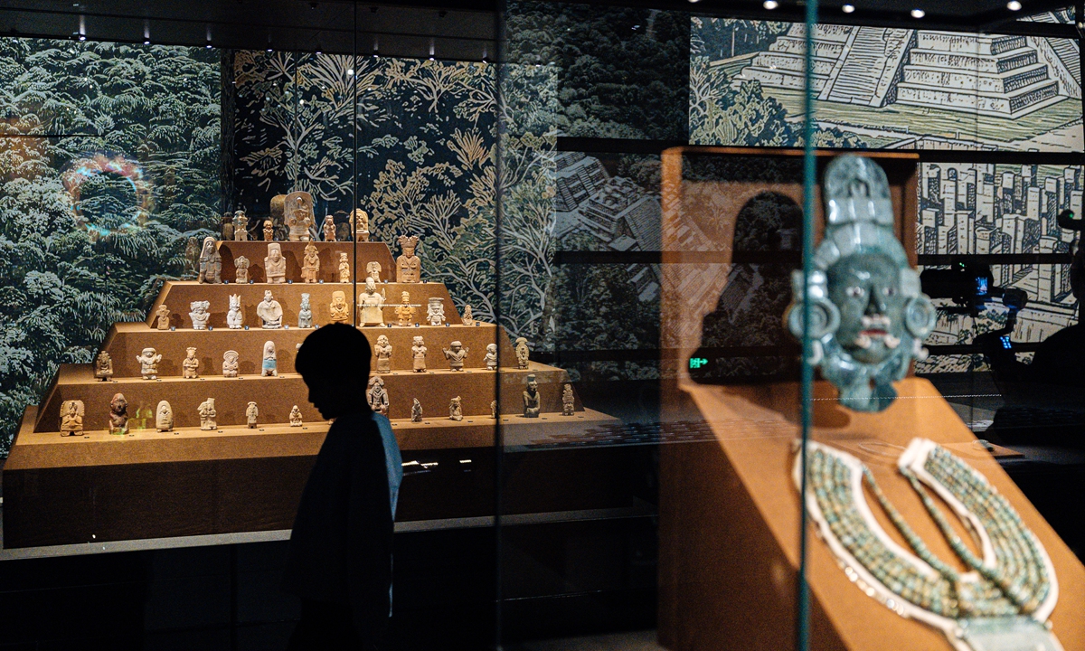 A kid walks past displayed artifacts at the Capital Museum in Beijing on May 17, 2026. Photo: Li Hao/GT