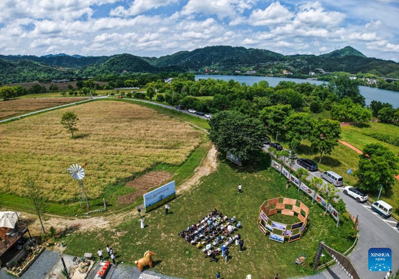 An aerial drone photo taken on May 16, 2026 shows an open air art exhibition in Zhijiang Village of Xiaya Town, Jiande City of east China's Zhejiang Province. A photography + oil painting dual art exhibition was unveiled in Zhijiang Village of Xiaya Town on Saturday. Breaking the conventional boundaries of traditional art galleries, the exhibition is set amid fields, forests, and village paths. A total of 90 photography and oil painting works showcased the local rural customs and landscapes, with the majority of the artists being local villagers. Photo: Xinhua