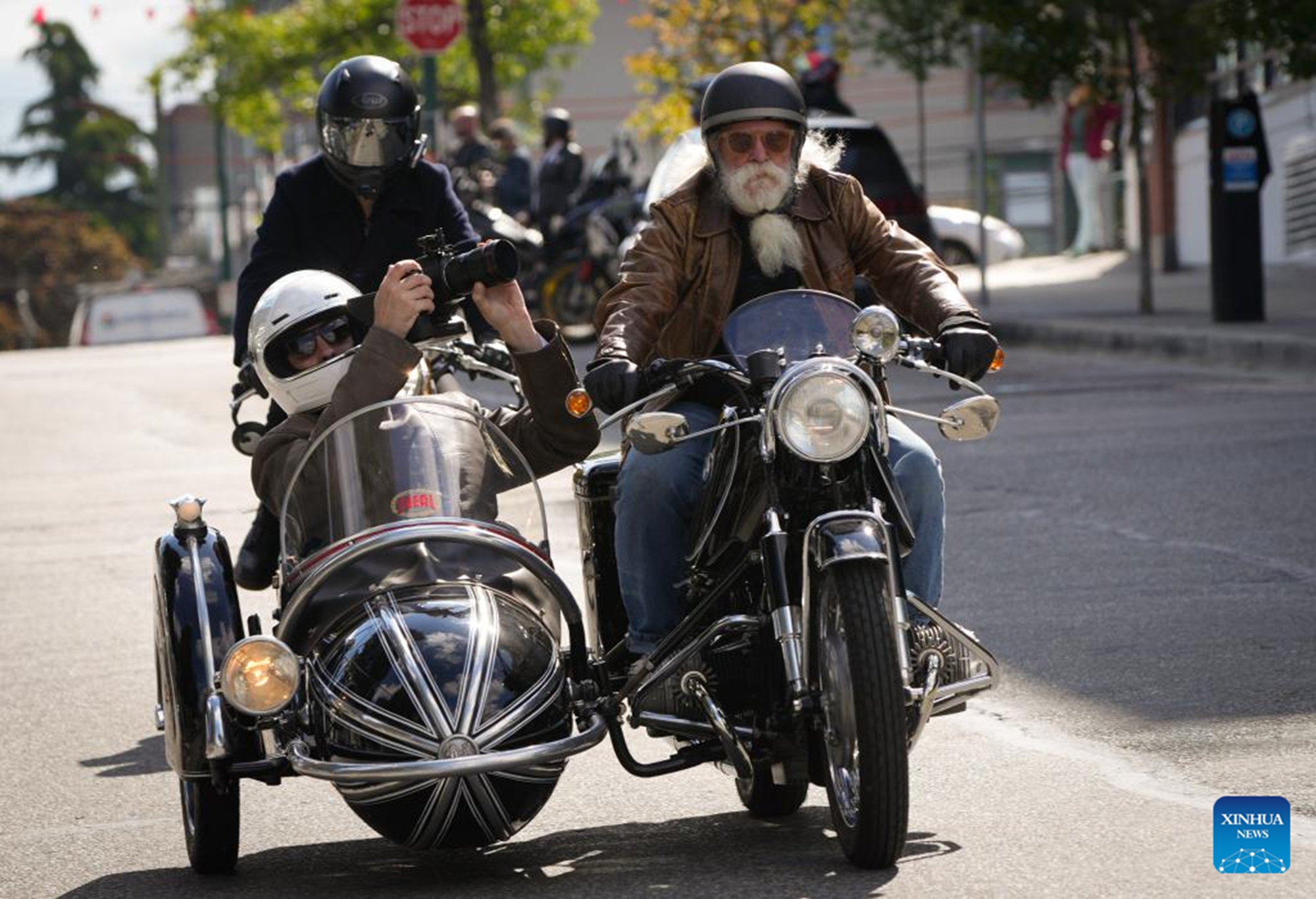 Riders in vintage attire take part in the 2026 Distinguished Gentleman's Ride in Vancouver, British Columbia, Canada, on May 17, 2026. The annual event was held in many cities across Canada on Sunday to raise funds and awareness for men's health, attracting more than 300 dapper riders. (Photo by Liang Sen/Xinhua)