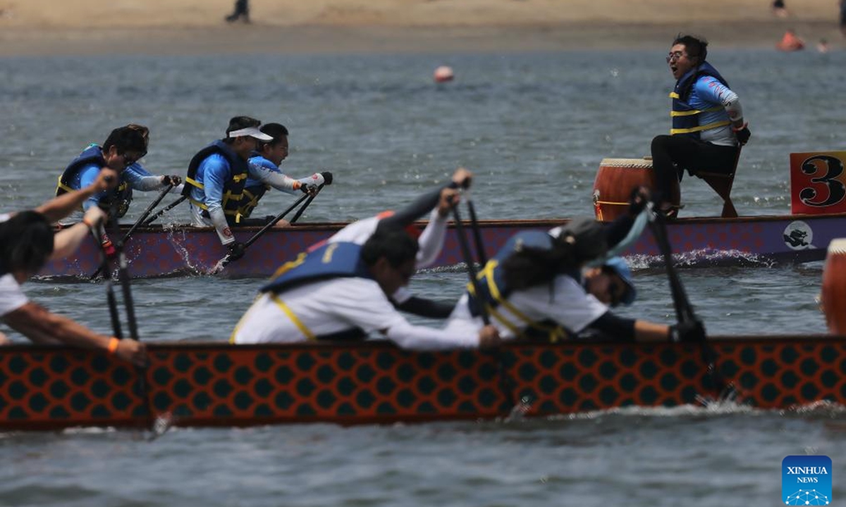 Contestants compete during the annual San Diego Dragon Boat Festival at Mission Bay in San Diego, California, the United States, on May 16, 2026. (Photo by Qiu Chen/Xinhua)


