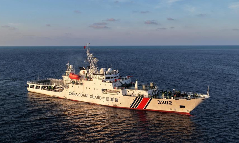 An aerial drone photo taken on May 1, 2026 shows the China Coast Guard (CCG) vessel Chuanshan patrolling around reefs in the territorial waters of China's Huangyan Dao in the South China Sea. (Xinhua/Chen Bin)