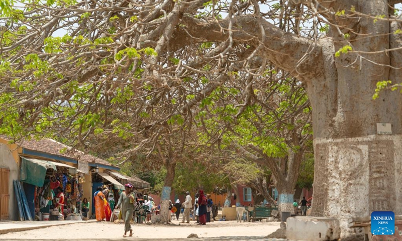 Tourists visit Goree Island in Senegal on May 16, 2026. Goree Island lies off the coast of Senegal, opposite Dakar. Ruled in succession by the Portuguese, Dutch, English and French, it was the largest slave-trading center on the African coast from the 15th to the 19th century. (Xinhua/Xie Jianfei)