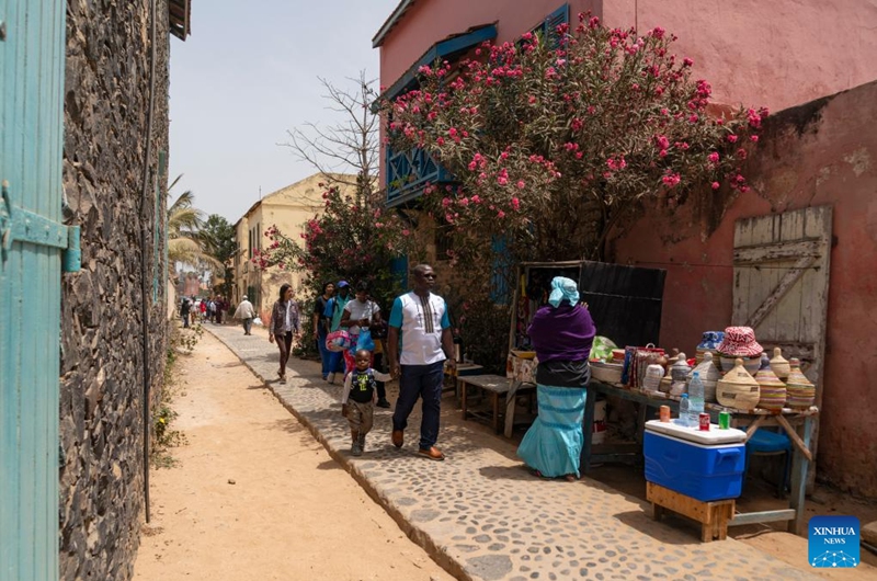 Tourists visit Goree Island in Senegal on May 16, 2026. Goree Island lies off the coast of Senegal, opposite Dakar. Ruled in succession by the Portuguese, Dutch, English and French, it was the largest slave-trading center on the African coast from the 15th to the 19th century. (Xinhua/Xie Jianfei)