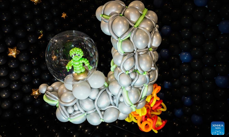 An alien-themed balloon installation is seen during the World Balloon Festival in Warsaw, Poland, May 15, 2026. The festival takes place here from May 15 to 17, featuring large themed installations featuring tropical jungles, underwater world, outer space and architectural landmarks created with more than 100,000 biodegradable balloons. (Photo by Jaap Arriens/Xinhua)