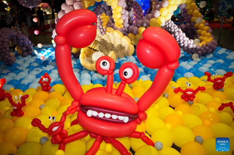 A crab-themed balloon installation is seen during the World Balloon Festival in Warsaw, Poland, May 15, 2026. The festival takes place here from May 15 to 17, featuring large themed installations featuring tropical jungles, underwater world, outer space and architectural landmarks created with more than 100,000 biodegradable balloons. (Photo by Jaap Arriens/Xinhua)