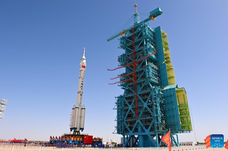 This photo taken on May 16, 2026 shows the combination of the Shenzhou-23 crewed spaceship and a Long March-2F carrier rocket being transferred to the launching area. (Photo by Wang Jiangbo/Xinhua)
