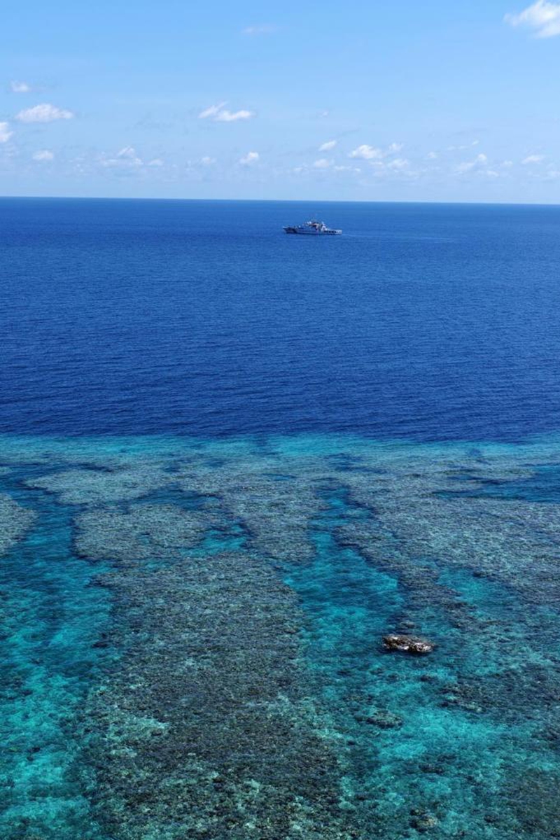 An aerial drone photo taken on April 28, 2026 shows the China Coast Guard (CCG) vessel Chuanshan patrolling around reefs in the territorial waters of China's Huangyan Dao in the South China Sea. (Xinhua/Chen Bin)